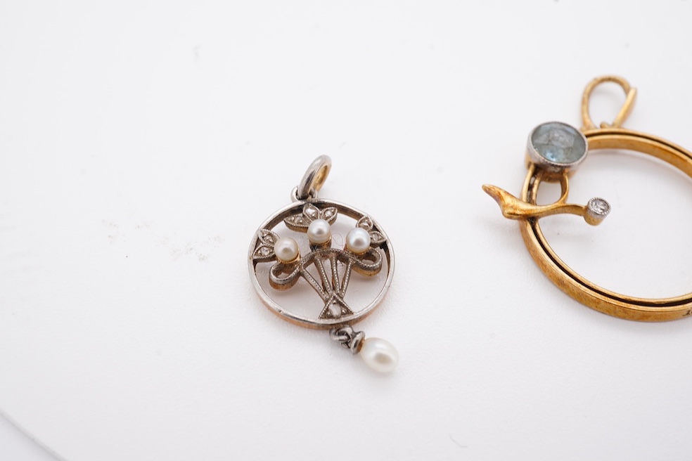 An early 20th century yellow metal, diamond chip and seed pearl set drop pendant, overall 23mm, together with a similar yellow metal, diamond and gem set open work pendant, diameter 20mm, gross weight 3.7 grams. Conditio